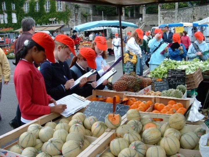 A group of students on a tour at the local market in France