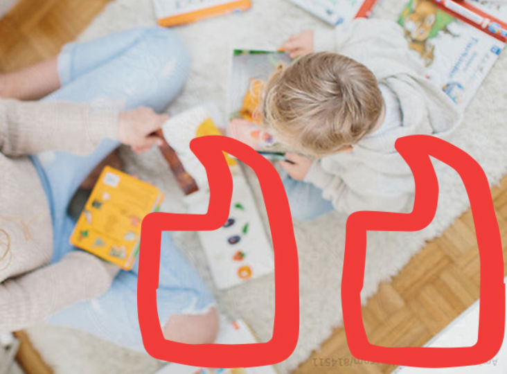 A little child looking at the learning materials